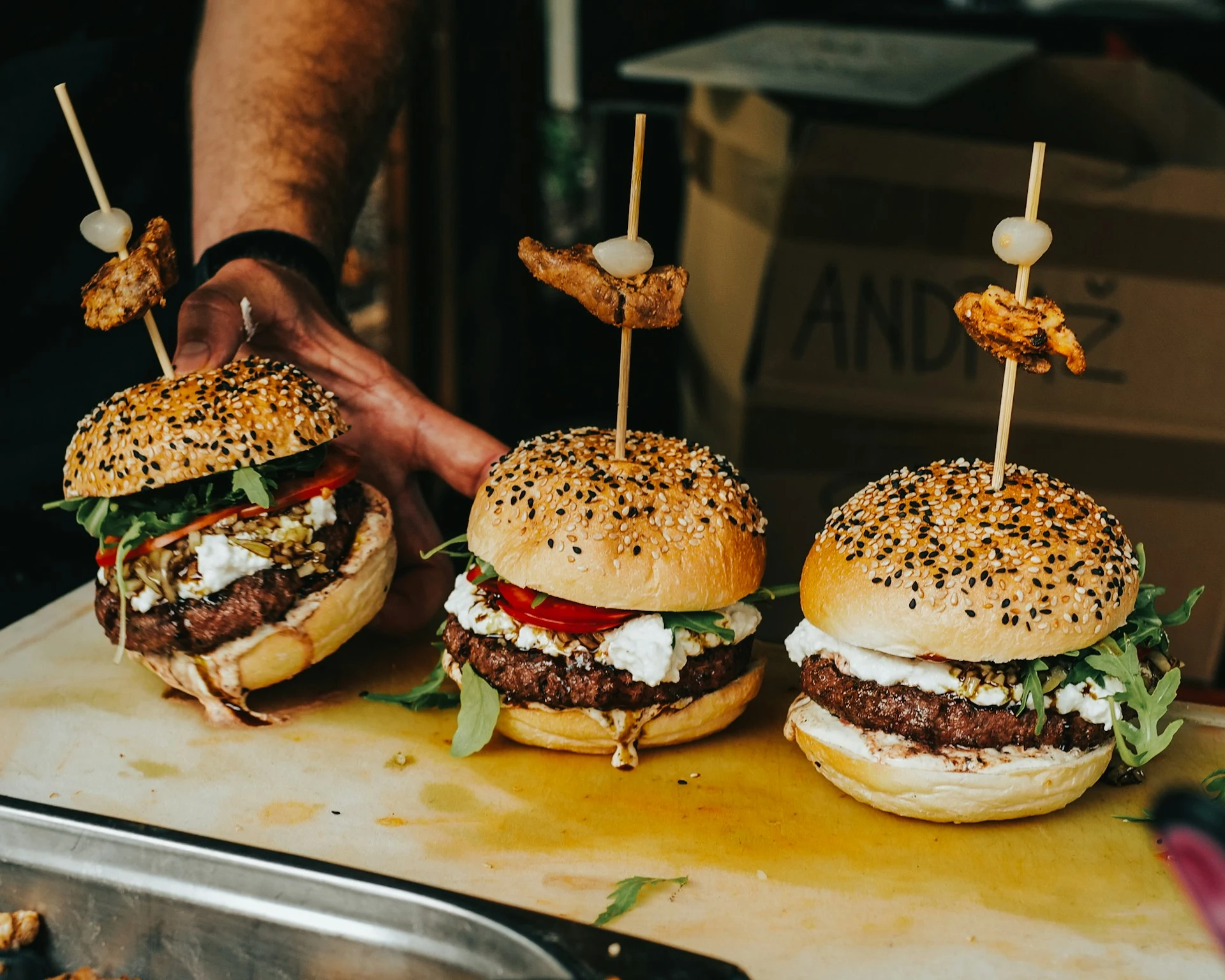 three tasty burgers ready to serve